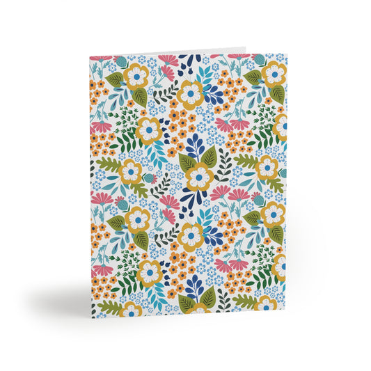 Wildflower Greeting Cards — Pack of 8/16/24 featuring hand-drawn wildflowers and greenery on a matte-finish card, offering a cheerful, springtime vibe. Perfect for sending heartfelt notes.