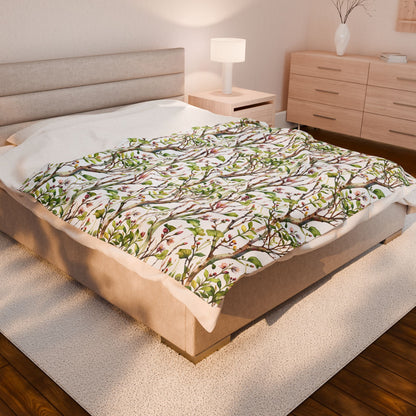 Plush Blanket - Blooming Forest Floor Design, featuring budding trees and flowers, draped over a bed with a dresser and lamp nearby, embodying FireBrook Essentials' cozy and uplifting style.