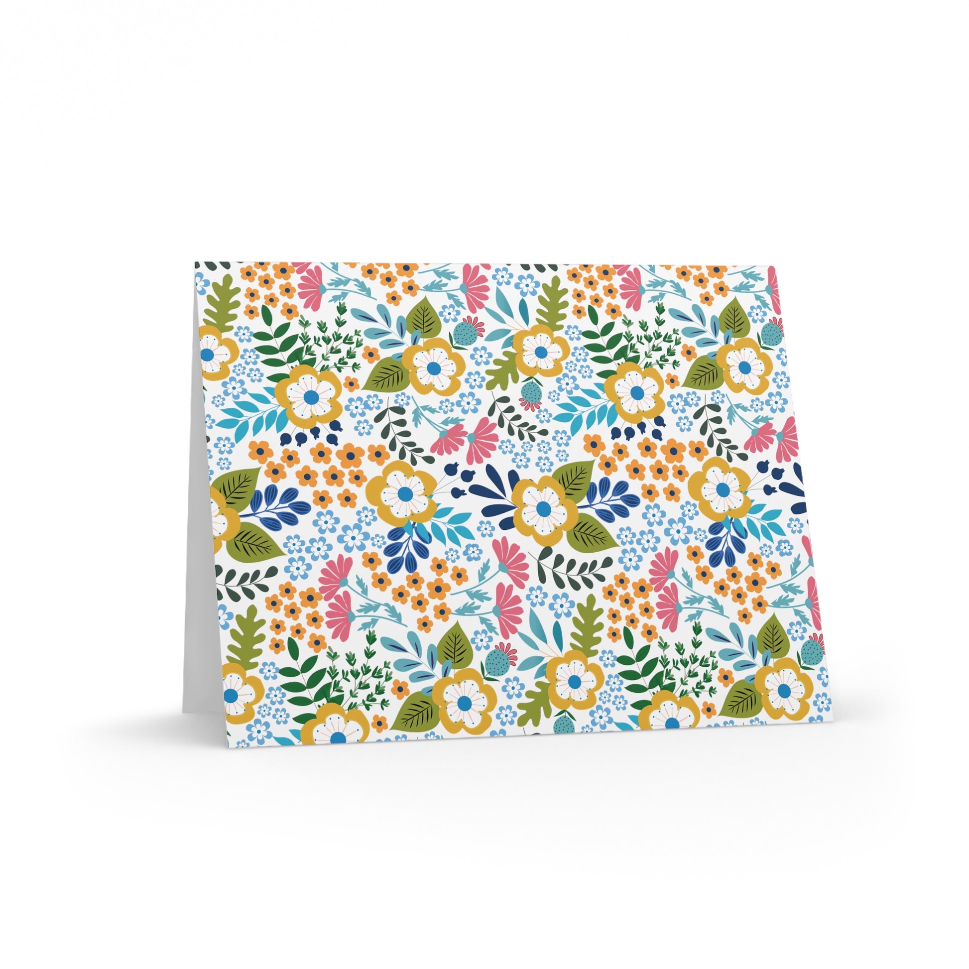 Wildflower Greeting Cards — Pack of 8/16/24 features a vibrant ditsy floral pattern on a matte-finish card, ideal for personal notes and celebrations. Each card includes a matching white envelope.