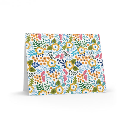 Wildflower Greeting Cards — Pack of 8/16/24, featuring vibrant, hand-drawn floral patterns on a matte-finish, white background. Perfect for personal messages, each card includes a matching white envelope.