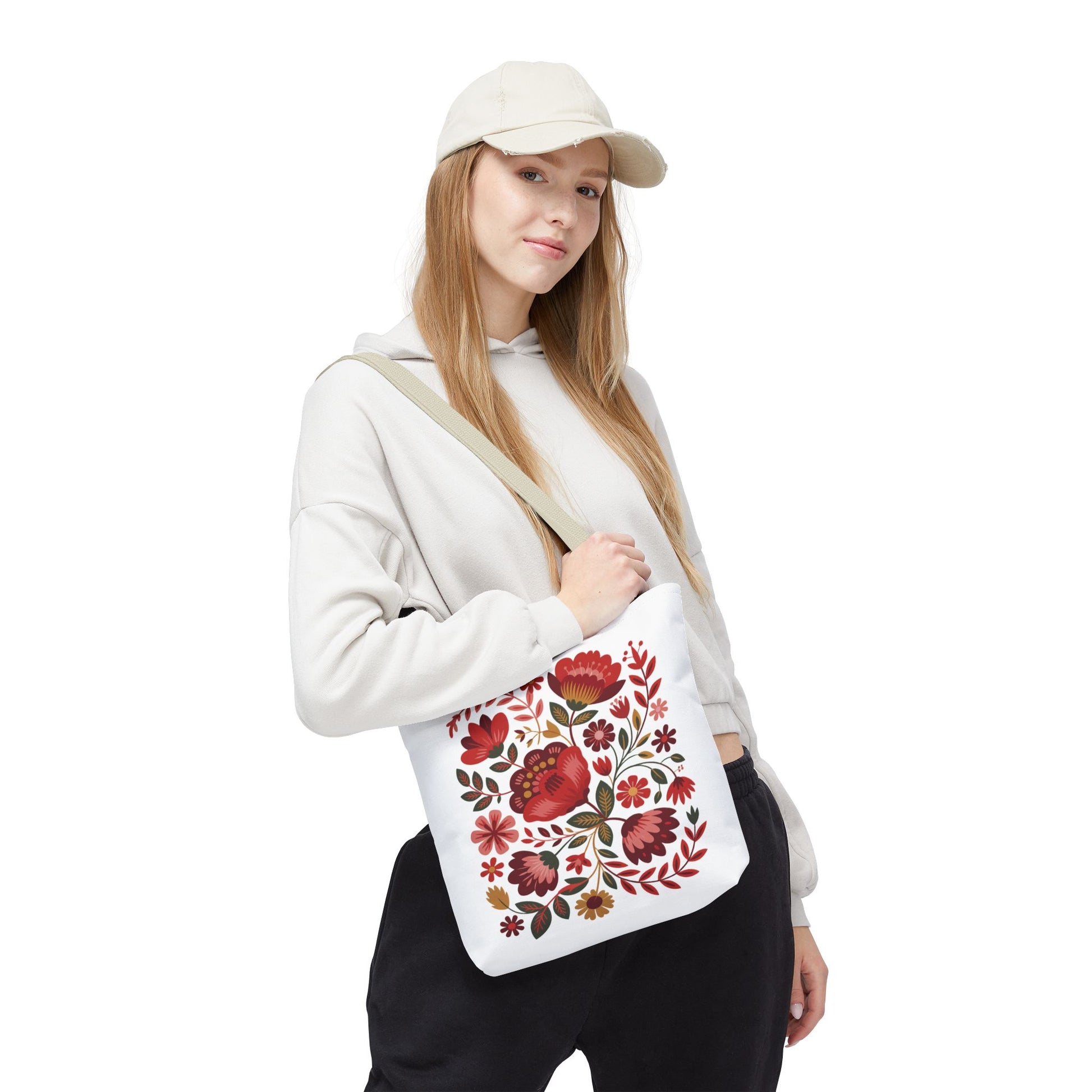 Red Floral Folk-Art Style Tote Bag featuring vibrant, organic floral illustrations in red tones with green leaves and navy accents. Ideal for everyday use, highlighting FireBrook Essentials' joyful and uplifting design ethos.