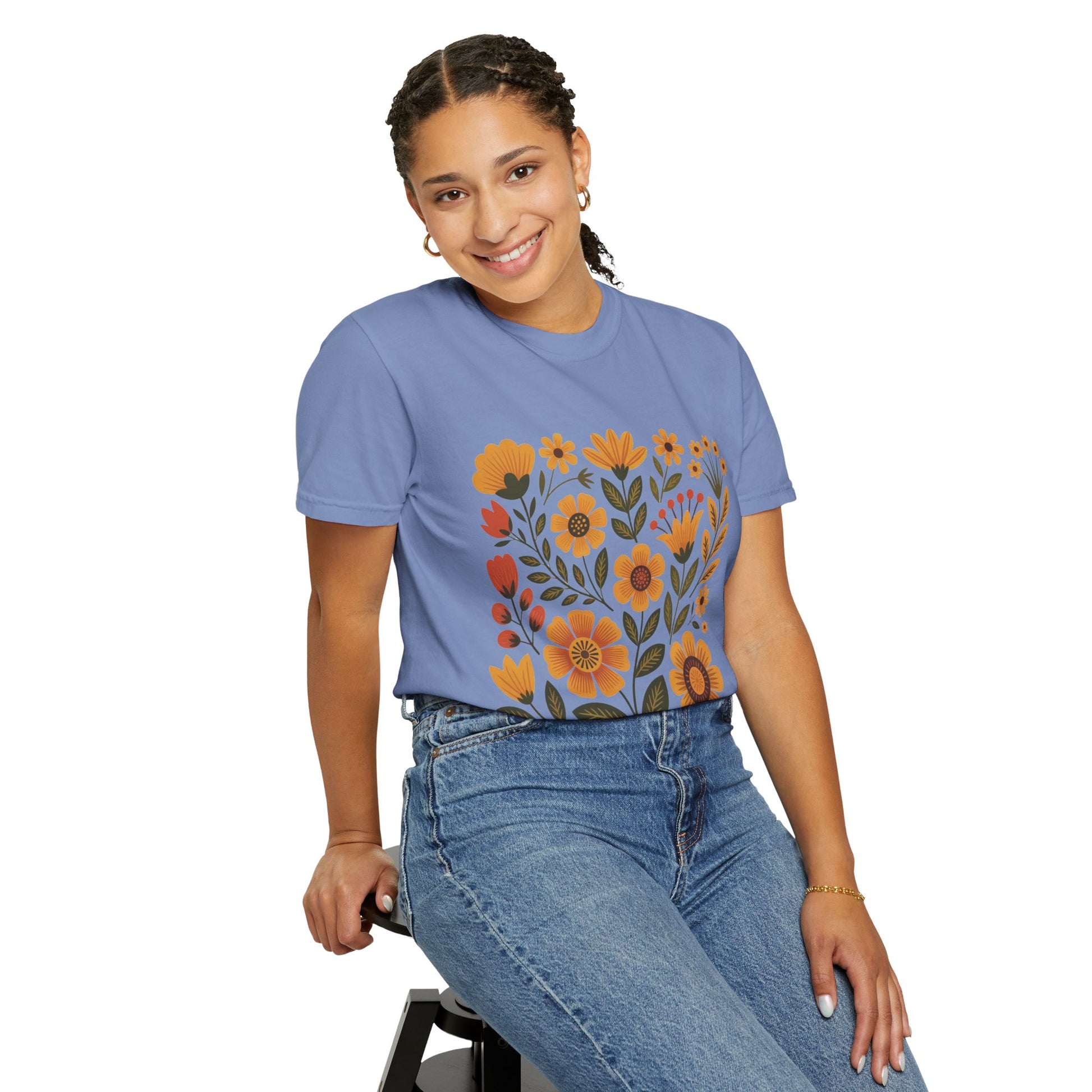 Folk Art in Warm Yellows Floral T-Shirt featuring an artistic folk art floral design in warm earth tones, perfect for casual wear. Made of high-quality cotton with a relaxed fit and crew neckline.