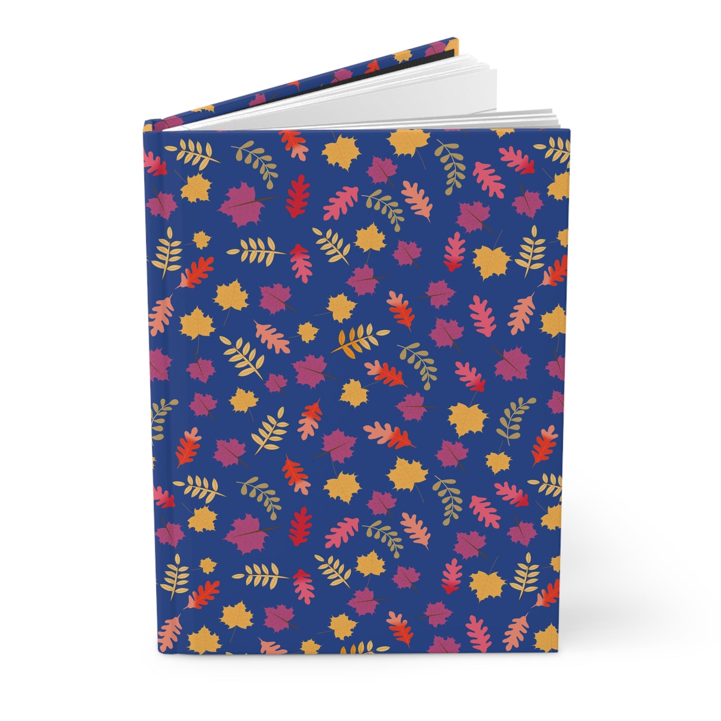 HARDCOVER JOURNAL, MATTE, RULED, 5X7, SEWN BIND, CLEAN-TEAR PAGES – FALL FOLIAGE, featuring a deep-blue cover adorned with vibrant autumn leaves, standing upright with pages fanned slightly open.