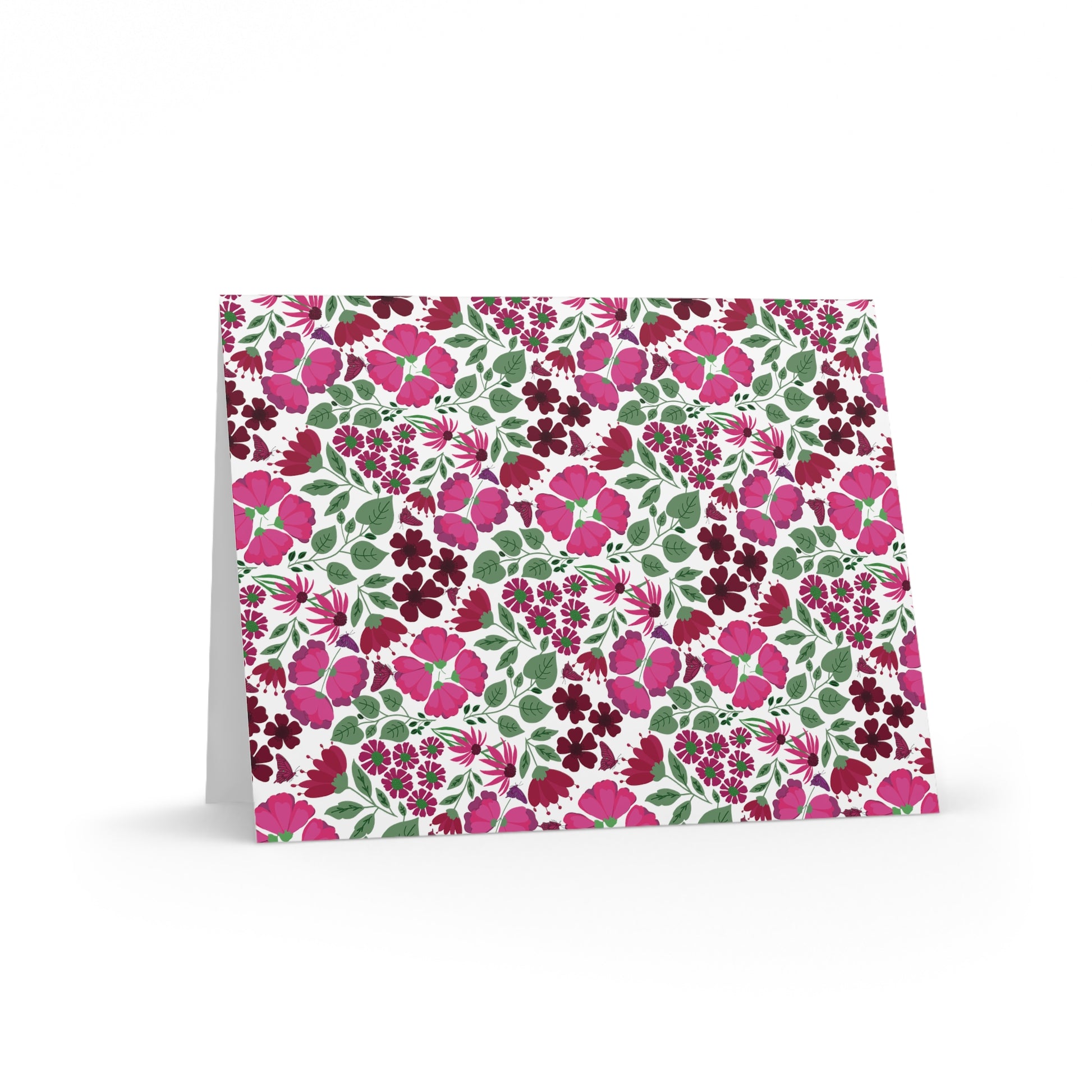 Floral Greeting Cards — Pack of 8/16/24, featuring a vibrant floral pattern of pink and magenta blossoms with green leaves on a folded card. Perfect for heartfelt messages, each card includes a matching white envelope.