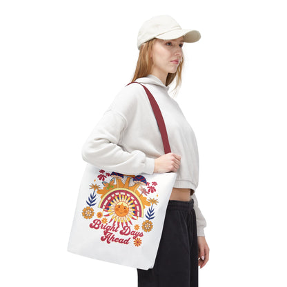 Bright Days Ahead Sunshine Floral Tote Bag features a cheerful design with sunshine, flowers, and butterflies, perfect for beach trips and picnics. Durable polyester body with reinforced handles ensures lasting use.