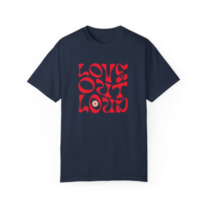 Love Out Loud T-Shirt featuring a relaxed fit and crew neckline. Garment-dyed for a soft texture, it showcases a unique 'LOVE OUT LOUD' design, embodying comfort and individuality.