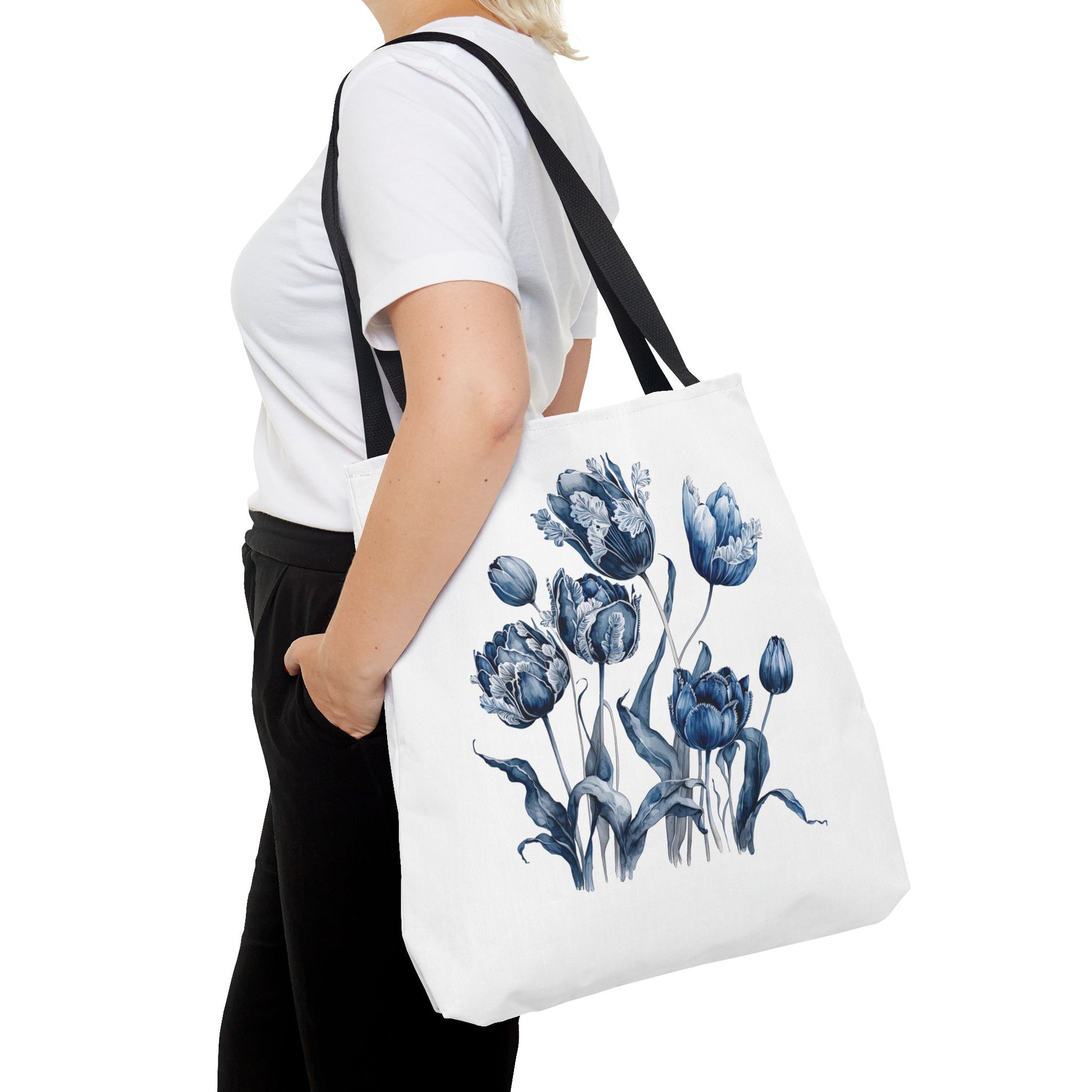 Flowers in Blue Hue Watercolor Tote Bag held by a woman, featuring blue floral design, ideal for stylish, functional everyday use.