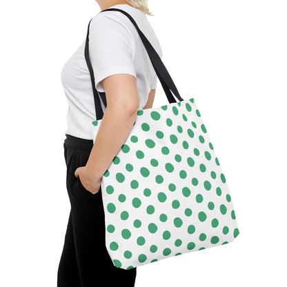 Green Polka Dots Tote Bag held by a woman, showcasing its vibrant polka dot pattern and sturdy handles—ideal for adding a cheerful touch to everyday outfits and outings.