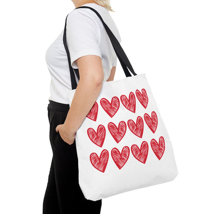 Hearts Tote Bag: A stylish white tote adorned with red hearts, perfect for adding a playful touch to any outfit. Ideal for expressing love, this bag embodies FireBrook Designs' joyful and uplifting aesthetic.