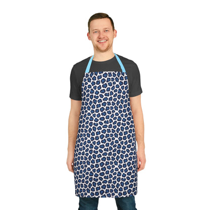 Apron, Cheetah Print: A stylish apron with a blue cheetah pattern, seen on a smiling man. Designed for comfort, it’s perfect for cooking or crafting, embodying FireBrook Essentials' joyful, uplifting style.