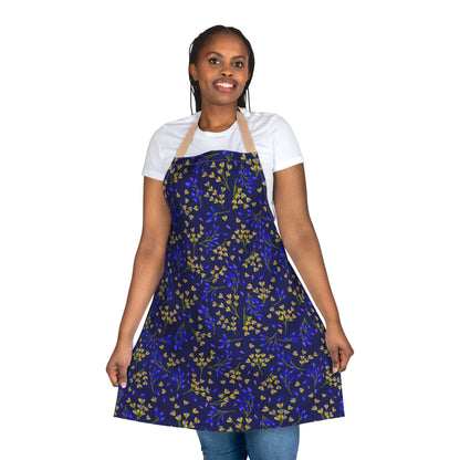 A person wears the Floral Apron, showcasing its vibrant botanical pattern. Made from soft polyester canvas, this apron offers comfort and protection, embodying FireBrook Essentials' blend of style and functionality.