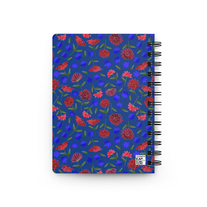 Spiral Notebook — Blue Floral Patterned Journal for Notes & Sketches: A vibrant blue cover adorned with red and purple blooms, featuring a sturdy metal spiral and a small QR-code label for easy page removal.