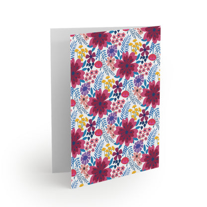Floral Wildflower Greeting Cards — Pack of 8/16/24 feature vibrant magenta and purple blooms with yellow and blue accents on a white background, embodying spring's joy. Perfect for heartfelt messages.