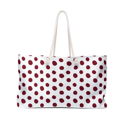 Burgundy Weekender Bag with cream rope handles and gold grommets, featuring a white and red polka dot pattern, perfect for stylish weekend getaways and travel.