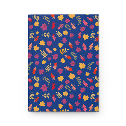 HARDCOVER JOURNAL, MATTE, RULED, 5X7, SEWN BIND, CLEAN-TEAR PAGES – FALL FOLIAGE features a vibrant autumn-leaf design on a deep blue cover, embodying FireBrook Designs' uplifting and stylish essence.