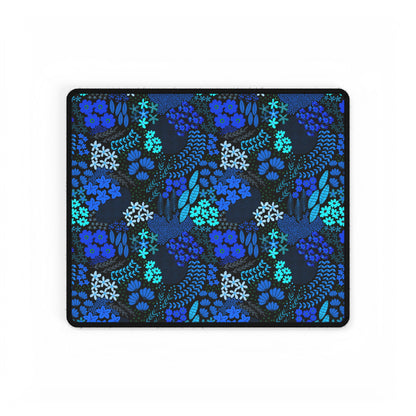 Blue Floral Desk Mat featuring a dark background with hand-drawn blue and teal botanical patterns, edged with a stitched black border. Ideal for adding elegance and style to your workspace.