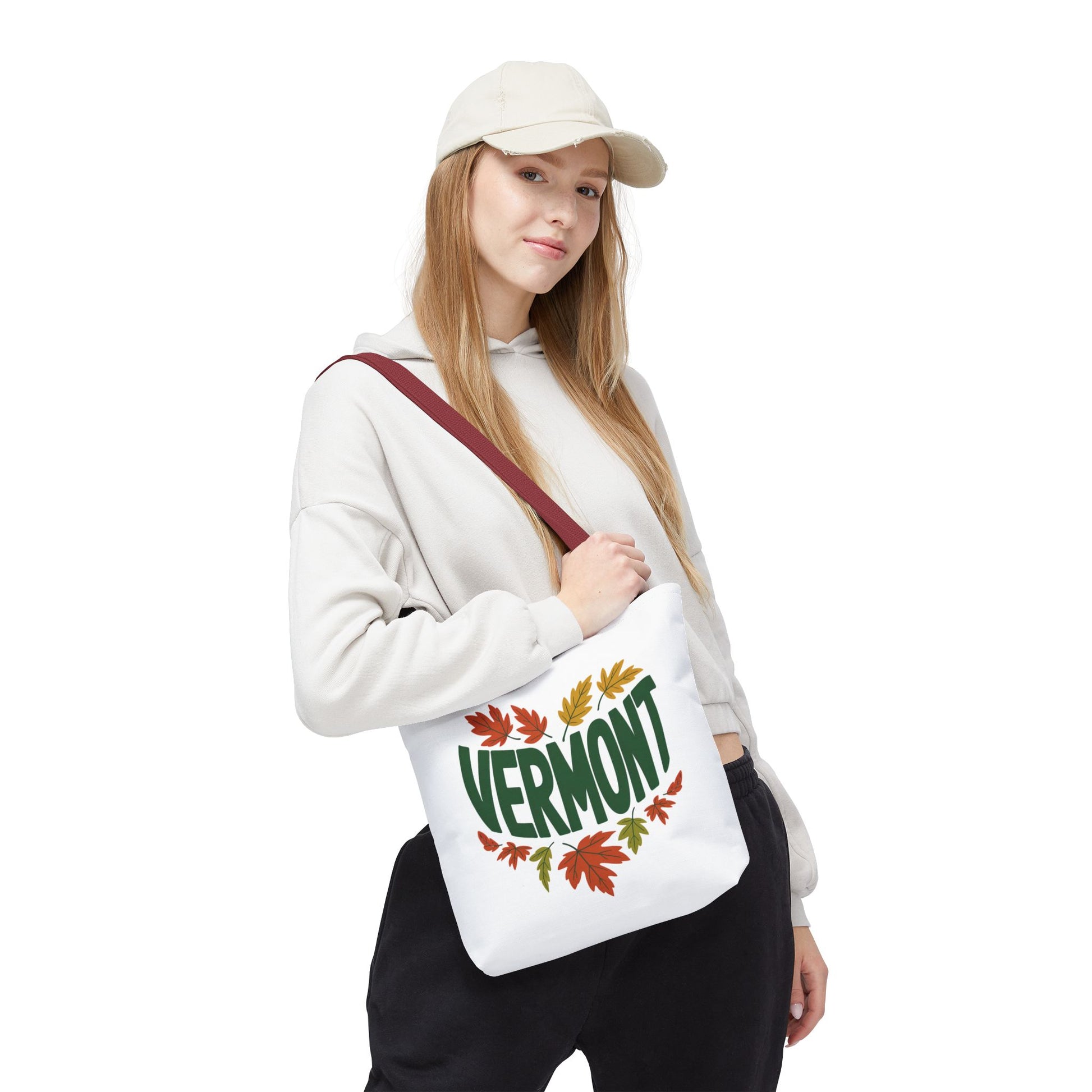 Close-up of a woman holding the Vermont Tote Bag, showcasing its reinforced stitching and durable polyester fabric, ideal for daily essentials. Part of FireBrook Designs' stylish and practical accessory line.