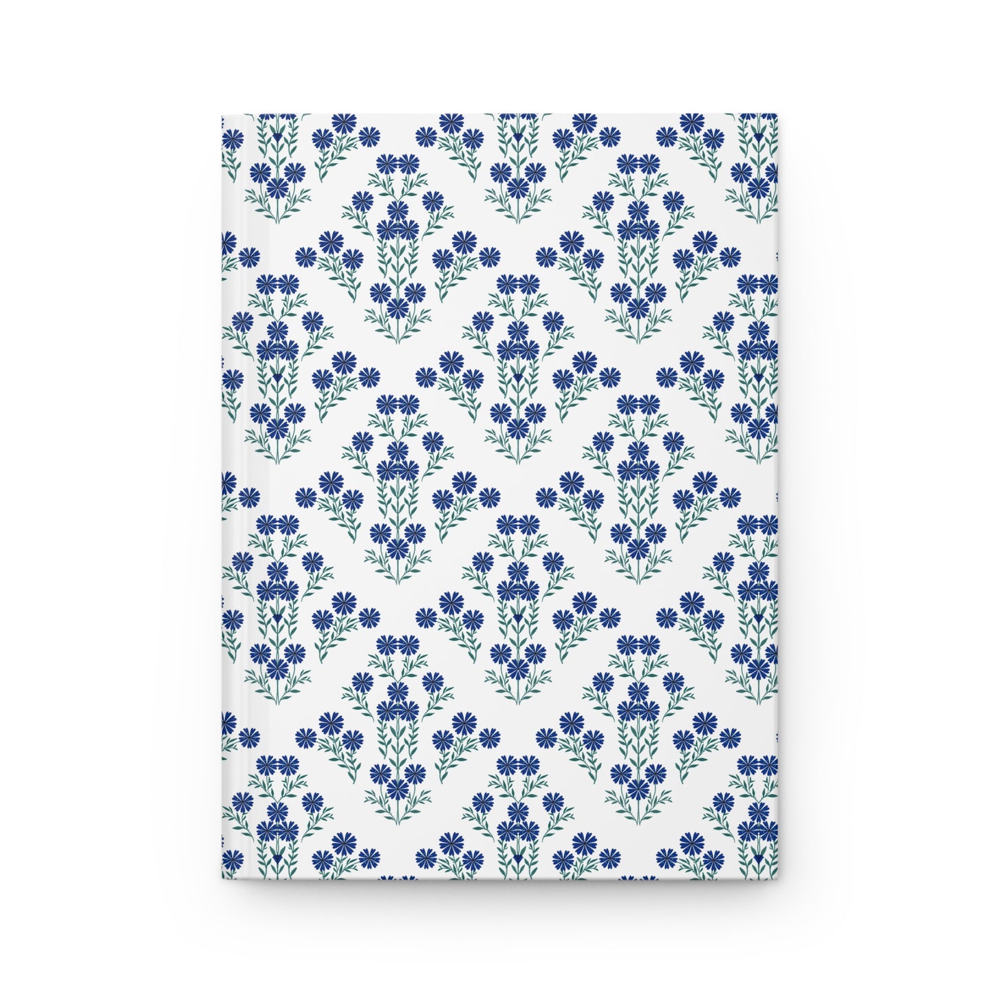 HARDCOVER JOURNAL, MATTE, RULED, 5X7, SEWN BIND, CLEAN-TEAR PAGES – INDIGO DAISY: White cover adorned with blue floral motifs in chevron pattern, offering elegance and functionality with 150 lined, easily removable pages.