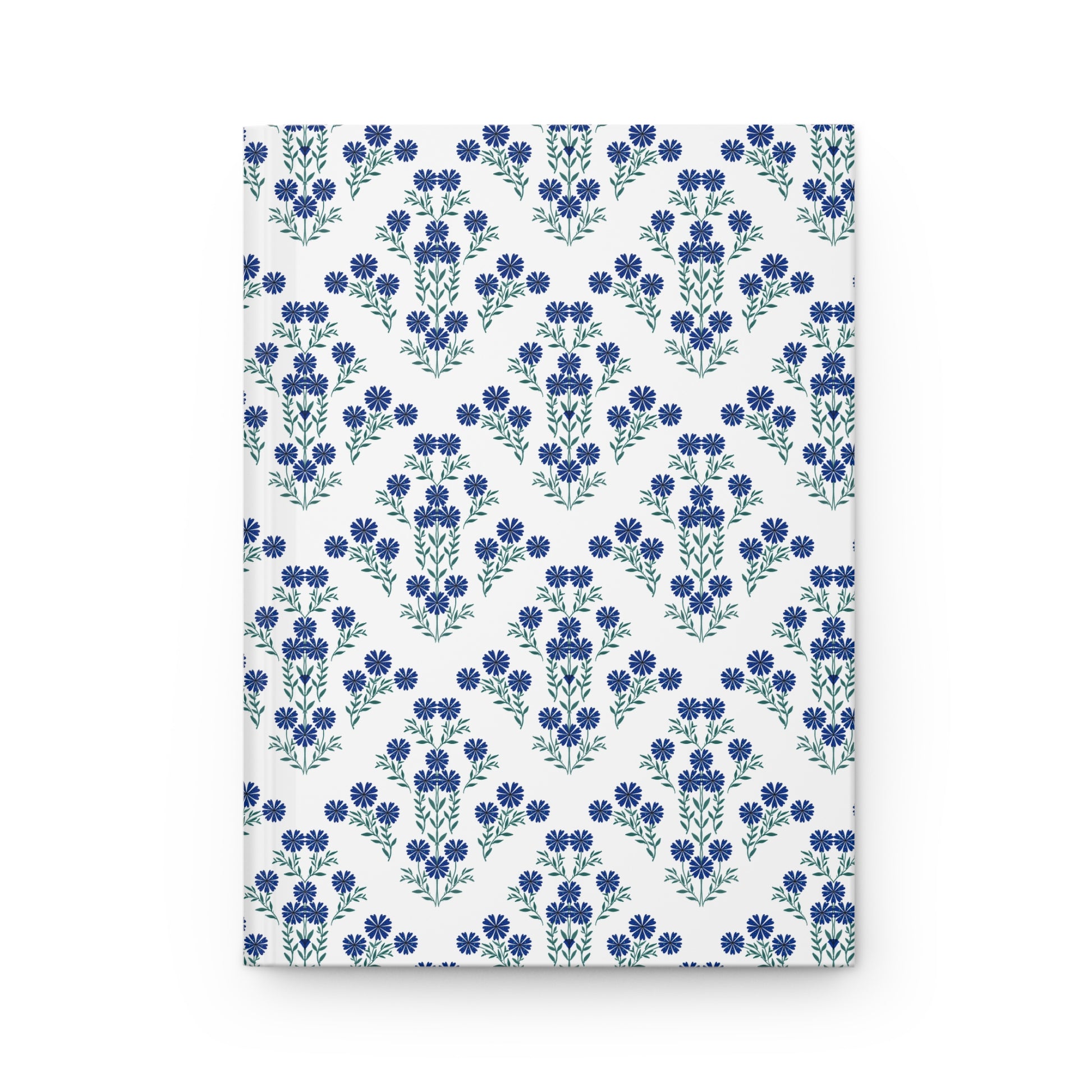HARDCOVER JOURNAL, MATTE, RULED, 5X7, SEWN BIND, CLEAN-TEAR PAGES – INDIGO DAISY: White cover adorned with blue floral motifs in chevron pattern, offering elegance and functionality with 150 lined, easily removable pages.
