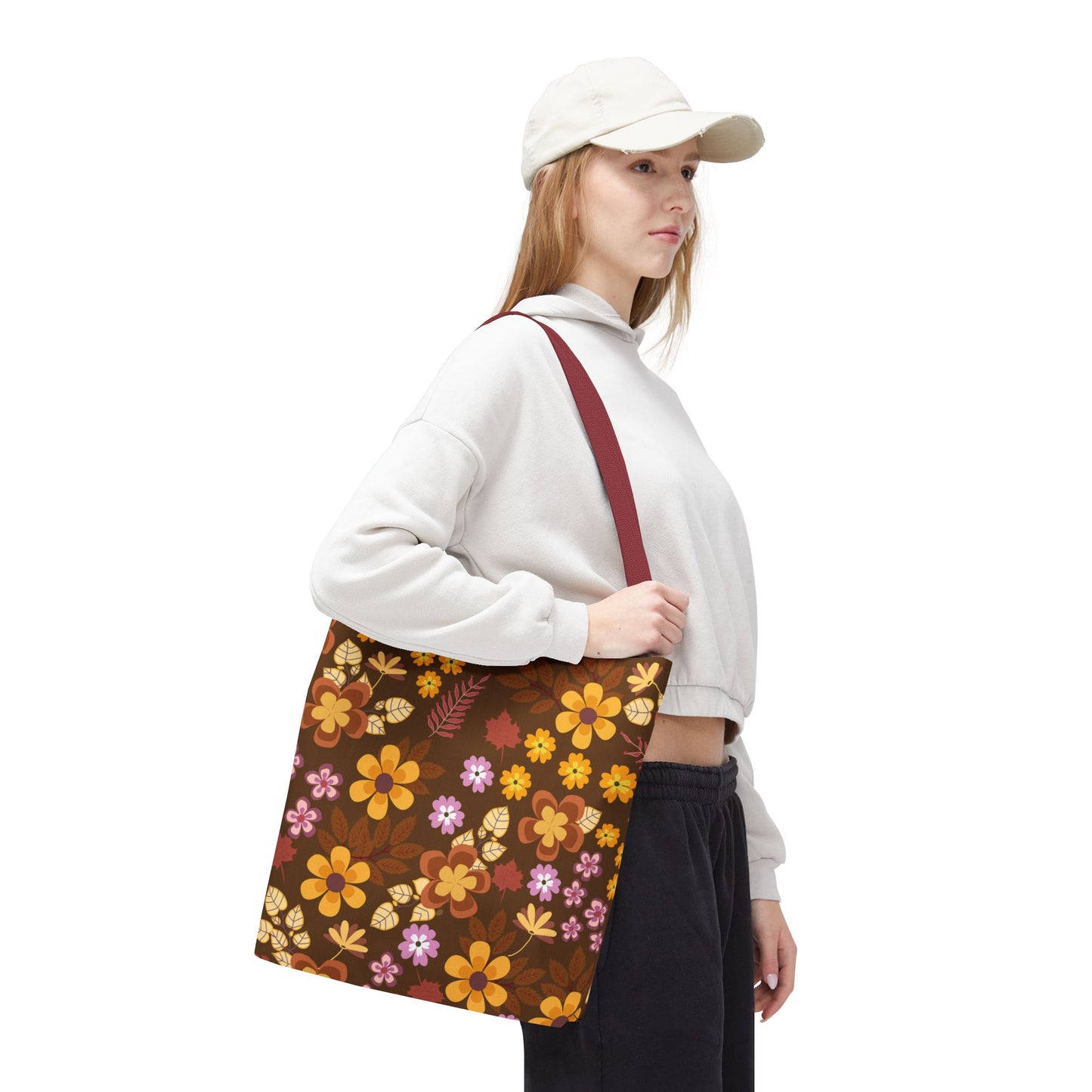 Floral Tote Bag carried by a casually dressed person, showcasing its retro-style floral design with vibrant shades. Ideal for summer outings, embodying FireBrook Essentials' focus on stylish, joyful living.