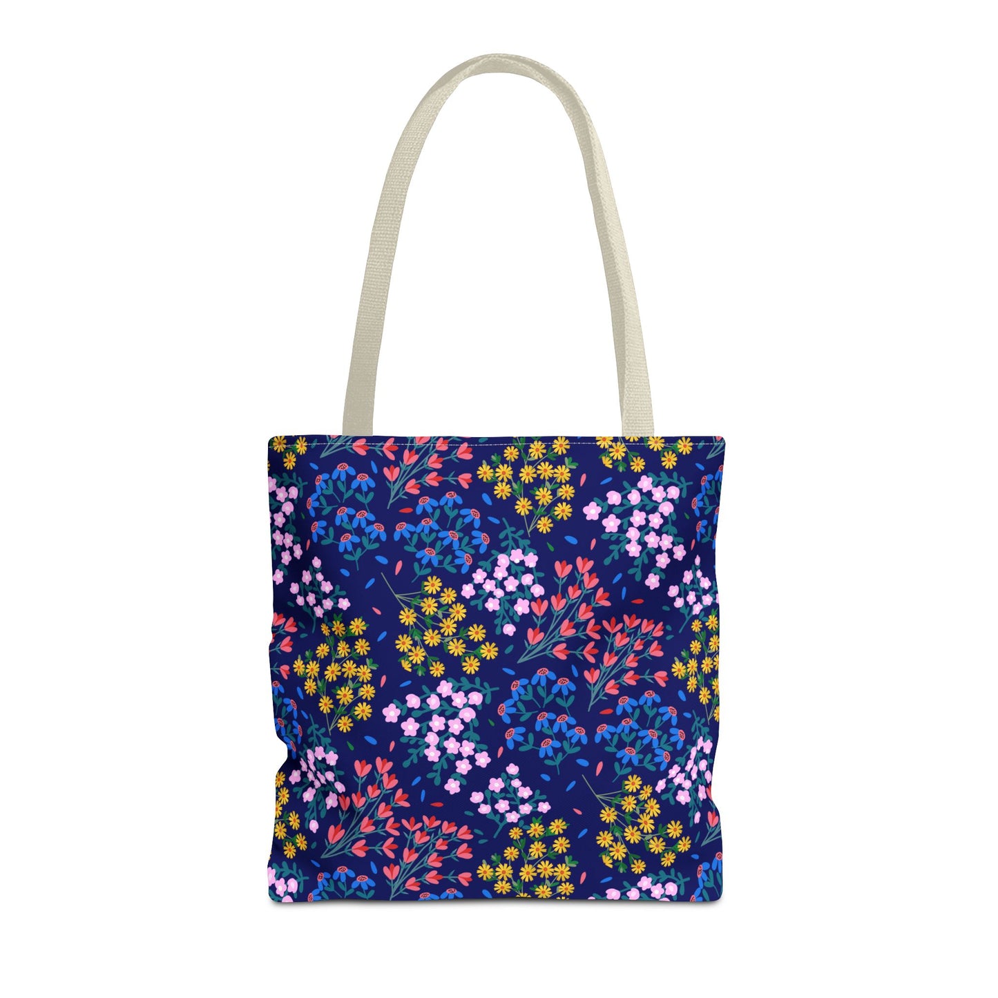 Midnight Garden Tote Bag with dark blue floral design and natural handles, showcasing a blend of coral, gold, and periwinkle flowers, embodying FireBrook Designs' stylish, joyful aesthetic.