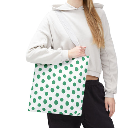 Green Polka Dots Tote Bag in a woman's hand, showcasing its playful design and durable polyester body. Ideal for adding vibrant style to casual outings, aligning with FireBrook Designs' ethos of joy and comfort.