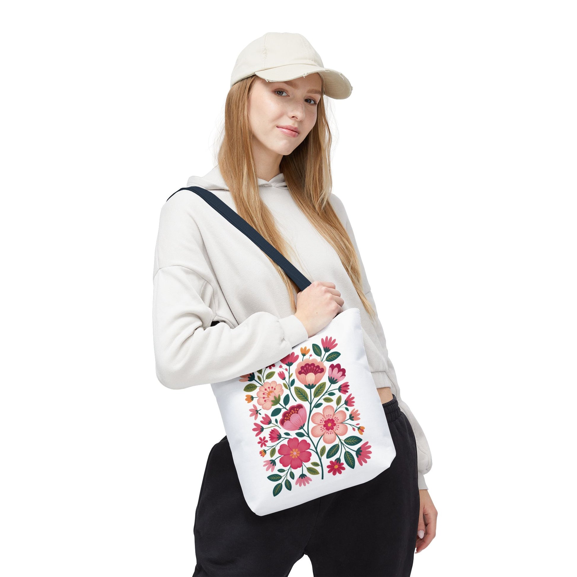 Pink Floral Folk-Art Style Tote Bag featuring vibrant organic floral illustrations in pink tones with green leaves, ideal for carrying essentials, reflecting FireBrook Essentials' commitment to stylish, uplifting designs.