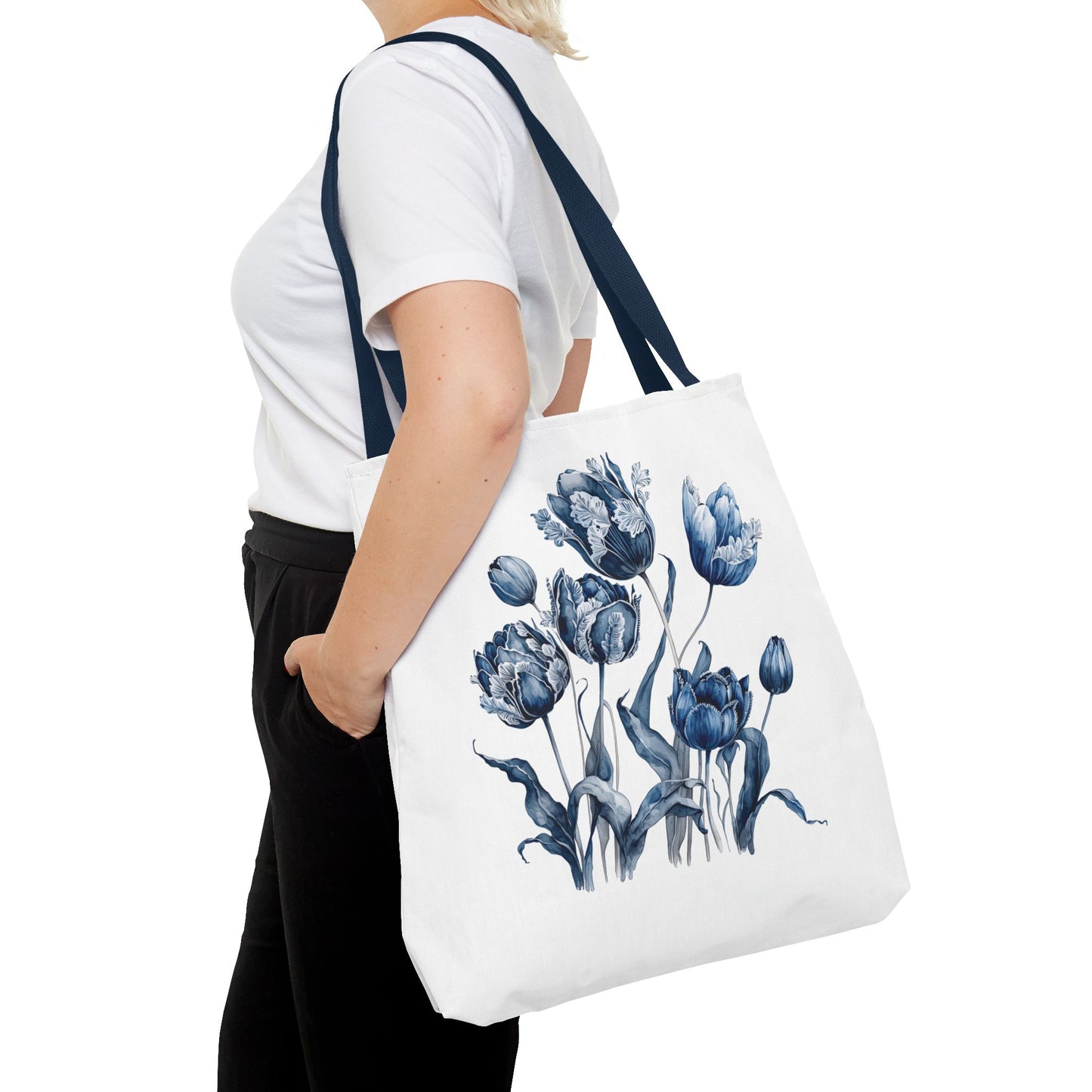 Flowers in Blue Hue Watercolor Tote Bag, featuring a white base with blue floral design, held by a person, ideal for everyday use.