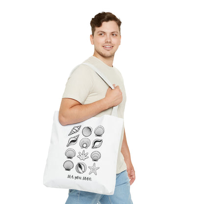 Sea Shells Tote Bag showcasing a beach-inspired design, crafted from durable polyester with reinforced stitching. Perfect for coastal outings, this essential accessory embodies FireBrook Essentials' commitment to style and joy.
