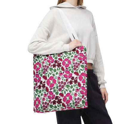 The Pink Lady Tote Bag showcases a vibrant pink and berry floral print, perfect for adding a pop of color to everyday outfits. Ideal for errands or beach trips, embodying FireBrook Designs' cheerful style.