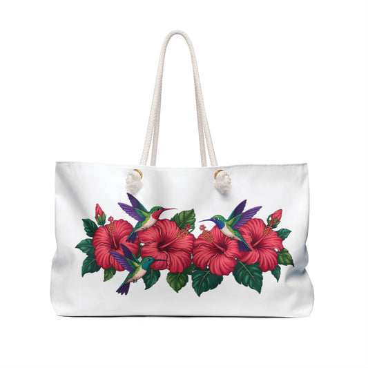 Tote Bag with hummingbirds and hibiscus design, showcasing vibrant hummingbirds hovering over hibiscus flowers. Ideal for stylish weekend getaways, reflecting FireBrook Designs' commitment to unique, uplifting products for joyful travel experiences.