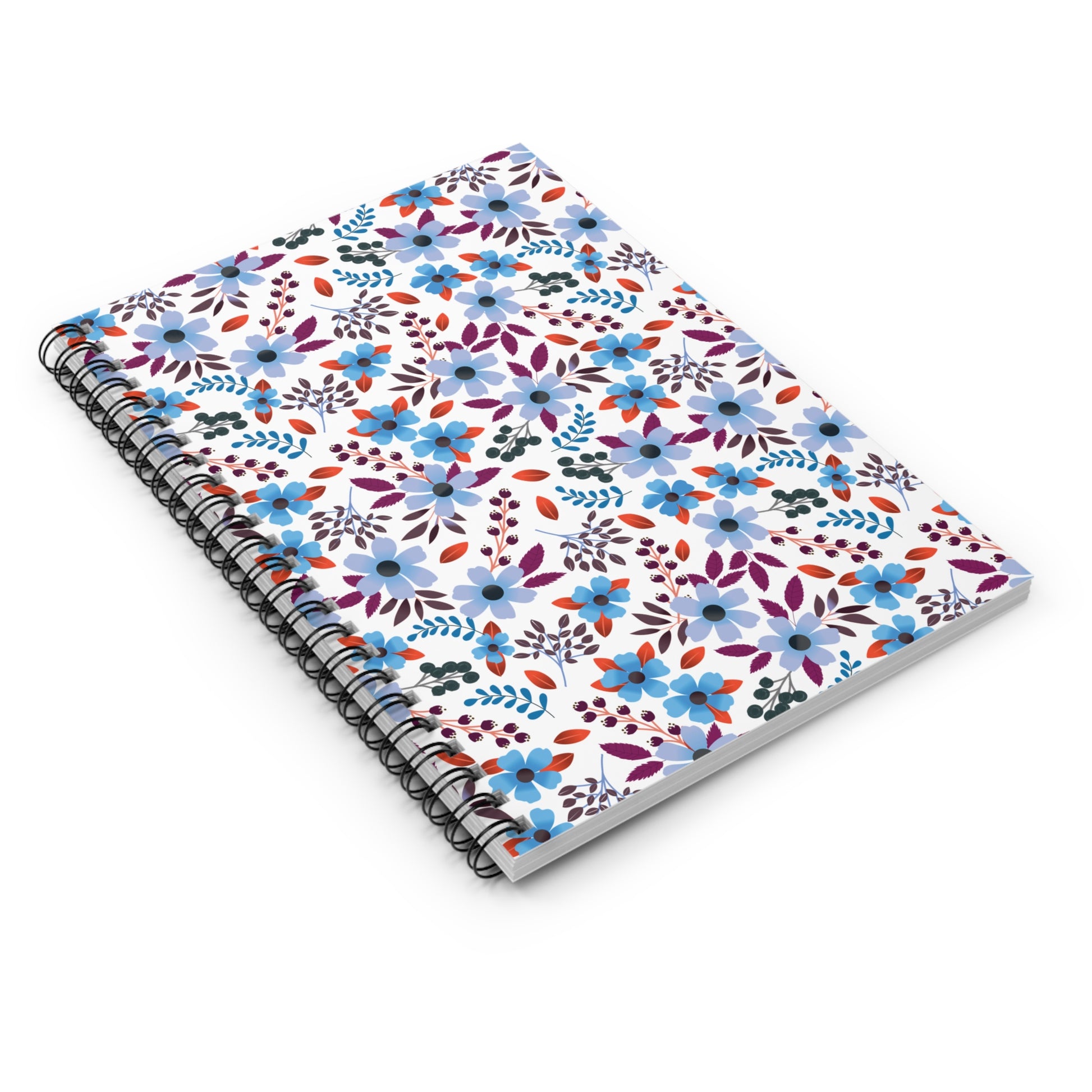 Floral Spiral Notebook with a vibrant floral cover featuring blue, purple, red, and green hues. Ideal for jotting notes or sketching, its durable spiral binding ensures easy page flipping. Compact, stylish, and eco-friendly design.