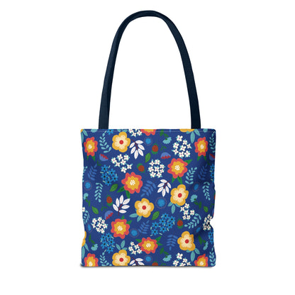 Floral Tote Bag with navy straps, featuring vibrant red, yellow, and white blossoms on a royal-blue background. Ideal for summer outings, reflecting FireBrook Designs' commitment to joyful, stylish essentials.
