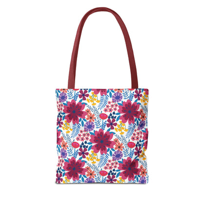 Floral Tote Bag with burgundy handles, showcasing a vibrant floral pattern in fuchsia-red, purple, yellow, and teal on white. Ideal for brightening summer outings, embodying FireBrook Designs' cheerful and stylish essence.
