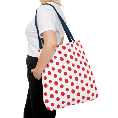 Red Polka Dots Tote Bag: A woman holds this vibrant, playful tote, featuring classic red polka dots. Ideal for everyday errands or beach trips, it embodies FireBrook Essentials' stylish, uplifting design ethos.