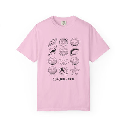 Seashells and Sea You Soon T-Shirt featuring a relaxed fit and beach-themed design, perfect for summer adventures. Crafted from ethically grown US cotton with durable double-needle stitching.