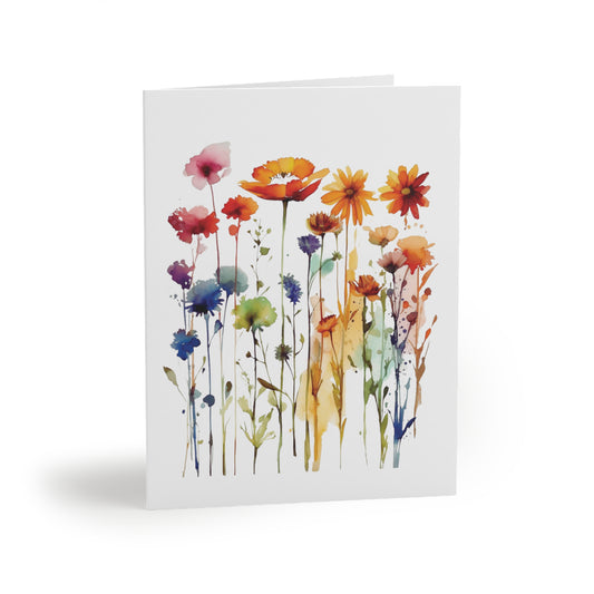 Wildflowers Greeting Cards — Pack of 8/16/24 feature a watercolor-style illustration of vibrant wildflowers on a matte-finish card, perfect for sending cheerful, personalized messages. Includes matching envelopes.