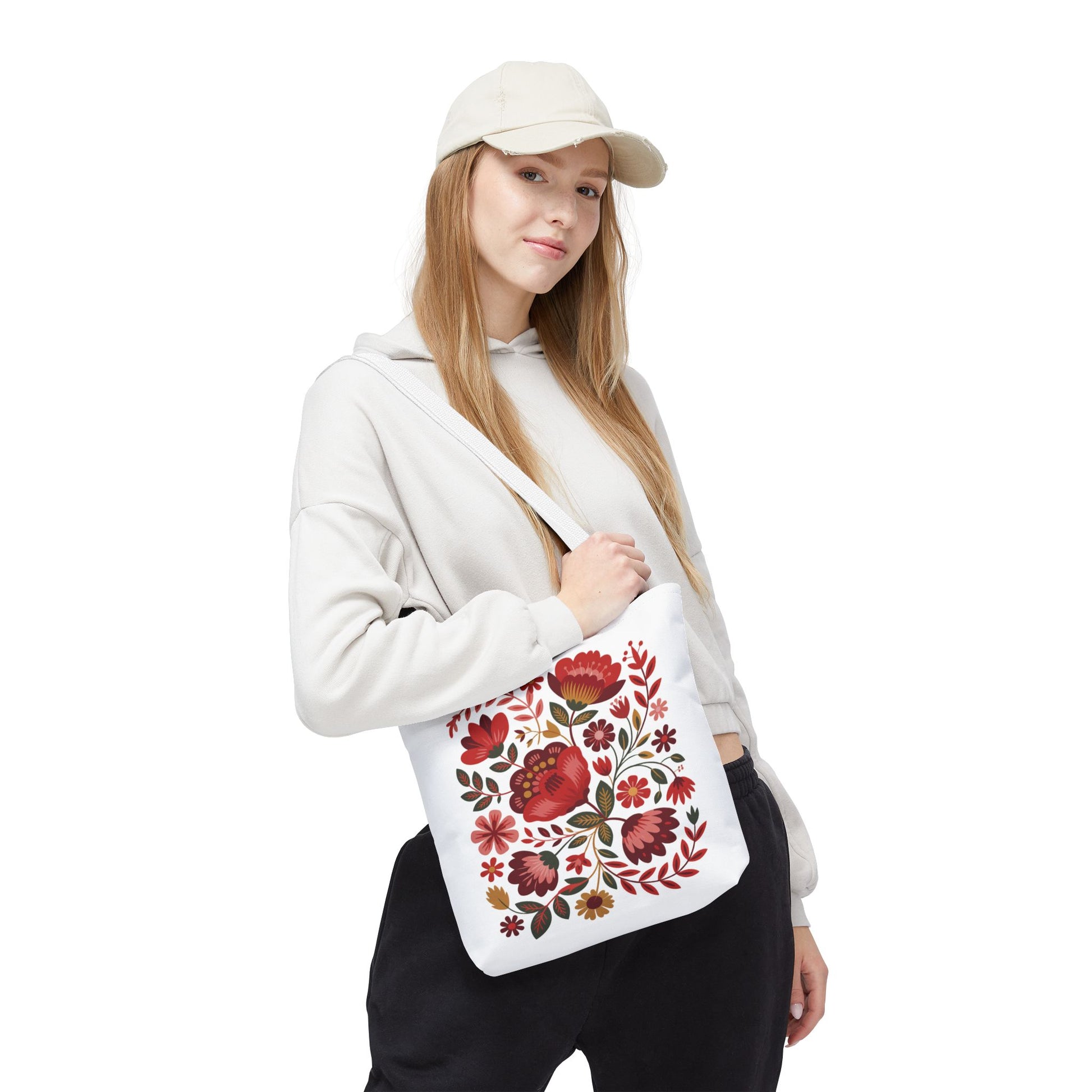 Red Floral Folk-Art Style Tote Bag featuring vibrant, organic floral patterns with red, blush, and blue flowers accented by green leaves, perfect for art lovers seeking a stylish, durable everyday carry solution.