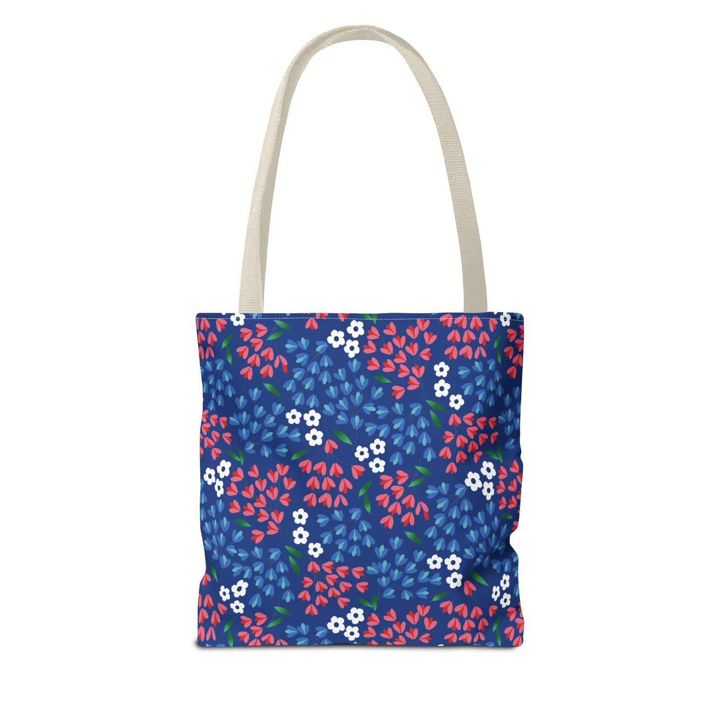 Floral Tote Bag: A vibrant canvas tote with blue background, adorned with red and light blue floral sprigs, tiny white flowers, and green leaves. Features natural straps, reinforced handles, and boxed corners for spacious carrying.