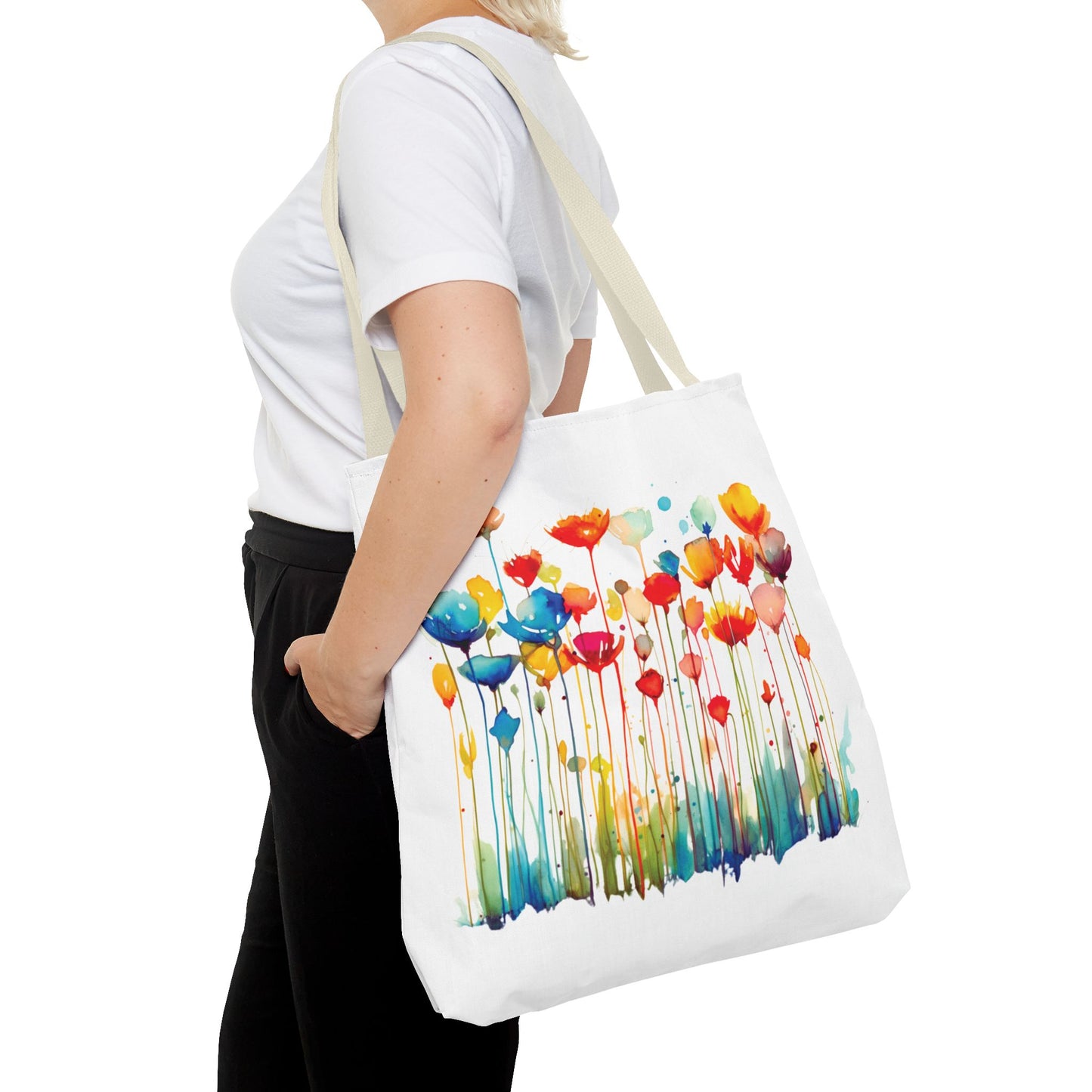 Woman holding a Watercolor Floral Tote Bag, showcasing its floral design and function, ideal for daily use and stylish errands.