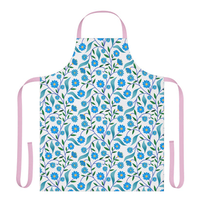 Apron Floral Design: A stylish kitchen apron with a pattern of blue flowers and green leaves, featuring pink straps. Made from soft, stain-free polyester canvas, perfect for cooking and crafting.