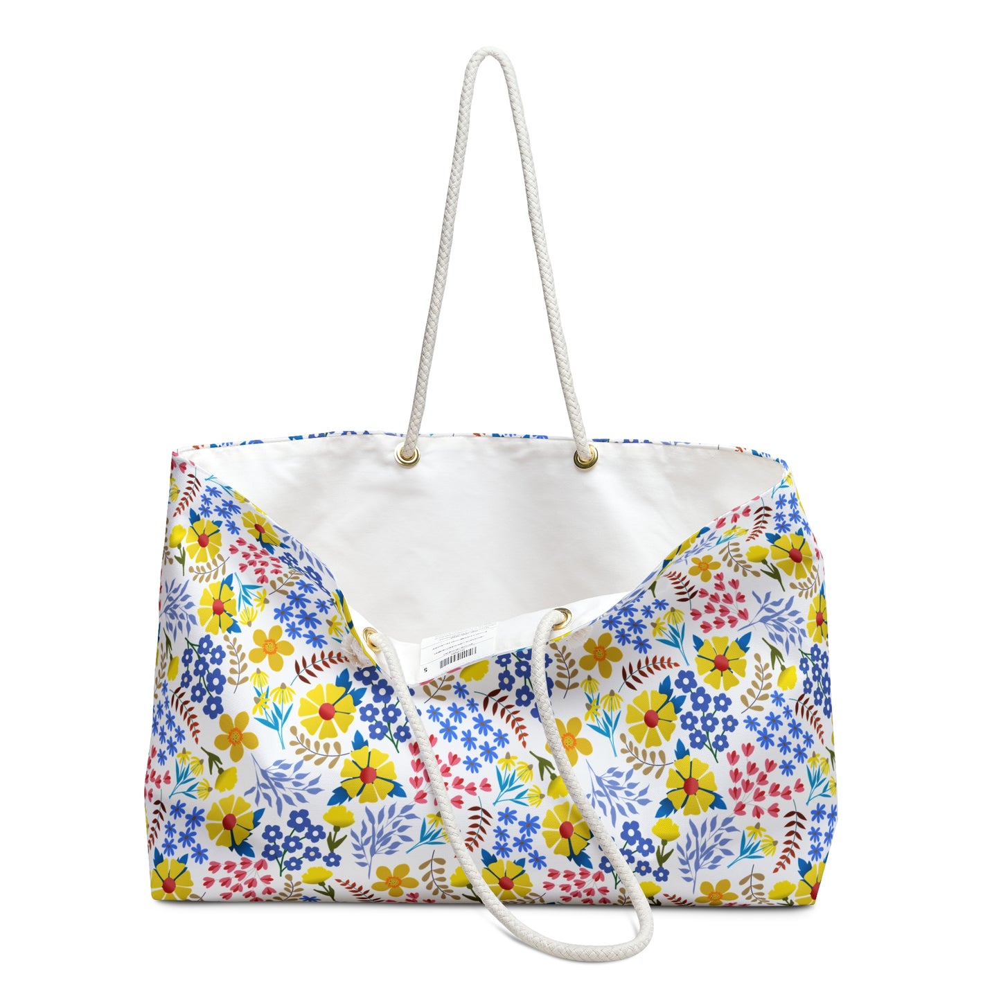 Weekender Bag featuring a vibrant floral print with thick white rope handles through gold-tone grommets, perfect for stylish travel. Unlined interior, spacious design, embodying FireBrook Essentials' joyful and uplifting style.
