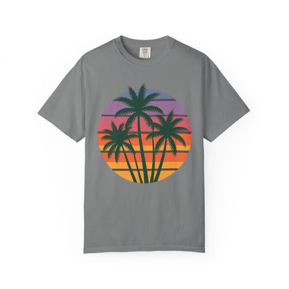 Palm Tree Sunset T-shirt showcasing vibrant palm tree silhouettes against a sunset sky, capturing a tropical, relaxed vibe. This unisex garment-dyed shirt from FireBrook Essentials embodies comfort and joy.