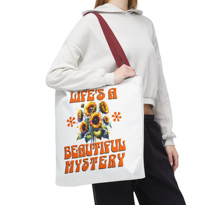Life's A Beautiful Mystery Tote Bag held by a woman, showcasing its durable polyester build and reinforced handles, suited for daily adventures and gifting.