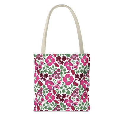 Pink Lady Tote Bag features an all-over floral print with pink and magenta flowers, green leaves, and off-white handles, embodying FireBrook Designs' joyful, stylish essence for everyday use.