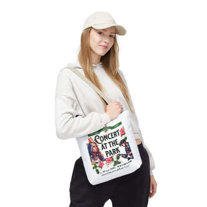 Woman holding Concert At the Park Tote Bag, showcasing its spacious design and music-themed print, ideal for outdoor activities and daily errands.