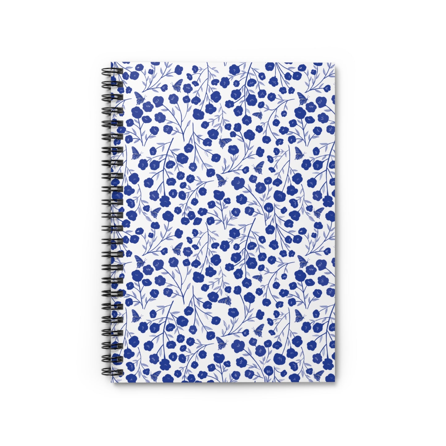 Floral Spiral Notebook with vibrant blue flowers and butterflies on a white cover, features a durable metal coil binding for easy page turning, ideal for creative notes and sketches.