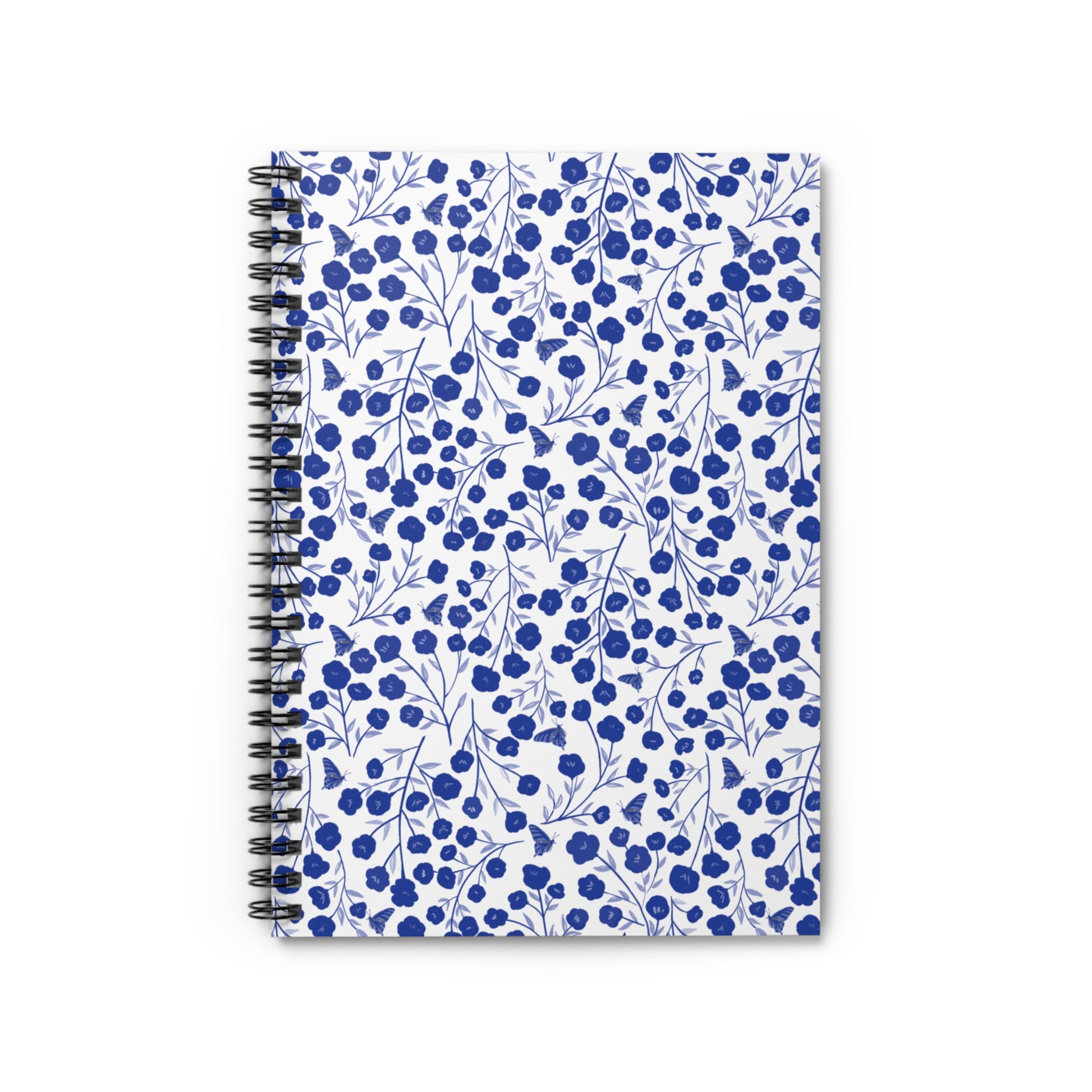 Floral Spiral Notebook with vibrant blue flowers and butterflies on a white cover, features a durable metal coil binding for easy page turning, ideal for creative notes and sketches.