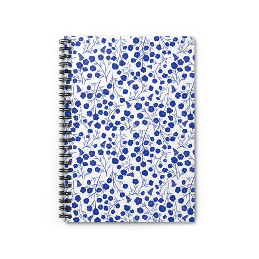 Floral Spiral Notebook with vibrant blue flowers and butterflies on a white cover, features a durable metal coil binding for easy page turning, ideal for creative notes and sketches.