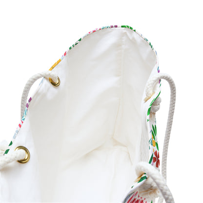 Weekender Bag featuring an off-white canvas with colorful floral trim, thick rope handles through brass grommets, and spacious interior—ideal for stylish travel, embodying FireBrook Essentials' blend of comfort and joy.